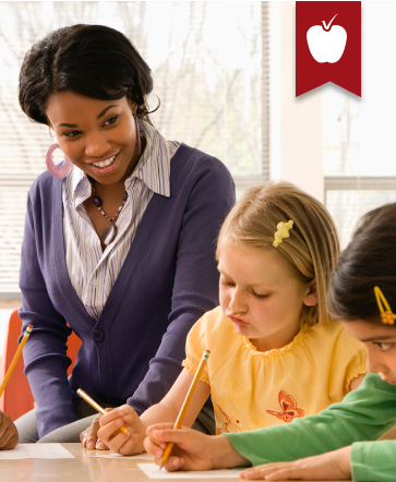 Teacher with students at desk